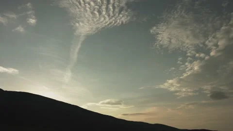 Beautiful time lapse of moving clouds, rays of light. Video stock 220650139