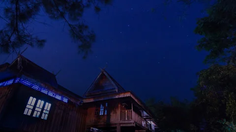 Beautiful time lapse star trail and thailand ancient house Stock Footage 25195251