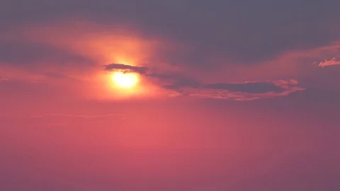 Beautiful time lapse sunrise through the clouds. Red sun Stock Footage 79599951