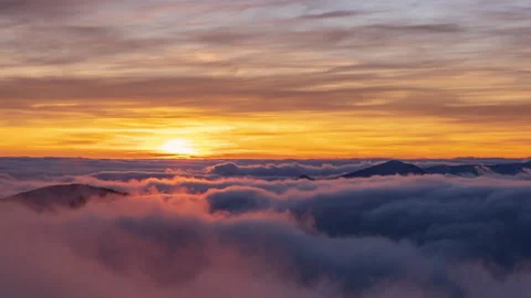 Beautiful time lapse video of sunset over sea of clouds Stock Footage 143695049