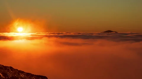 Beautiful time lapse video of sunset over sea of clouds Stock Footage 165564764