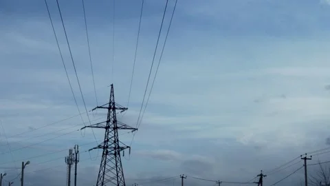 A Beautiful Time Lapse of White Clouds in a Blue Clear Sky and an Electric Tower Video stock 150585433