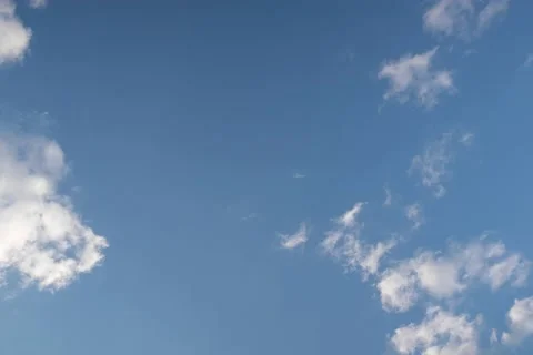 Beautiful timelaps video with fast-running clouds on a bright blue sky. High-res Stock Footage 155981228