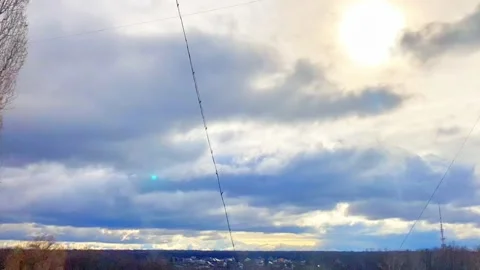 Beautiful timelaps video with fast-running clouds on a bright blue sky. Stock Footage 185027919