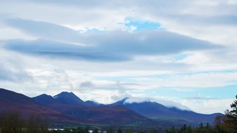 Beautiful Timelapse Of Clouds Rolling Over Mountains On Sunny Day Stock Footage 70839056