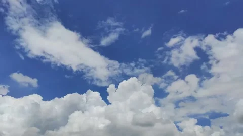 Beautiful Timelapse of fluffy white clouds in a blue sky 100FPS Stock Footage