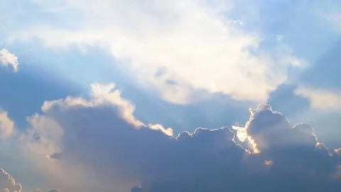 Beautiful timelapse with large clouds and sunshine breaking through cloud mass. Stock Footage 78970341