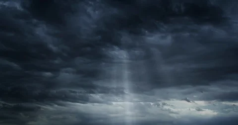 Beautiful Timelapse Loop of sun rays emerging though the dark storm clouds. Video stock 116665359