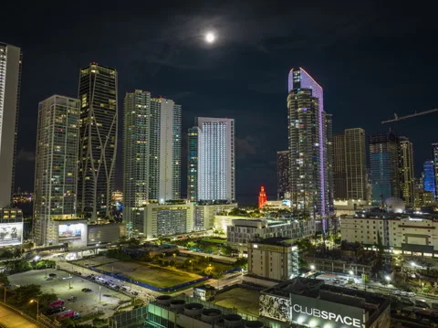 Beautiful Timelapse at night of Miami with clouds passing through Full Moon Video stock 242873955