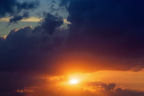 Beautiful timelapse of the sun going down among the moving clouds. Stock Footage 131112121