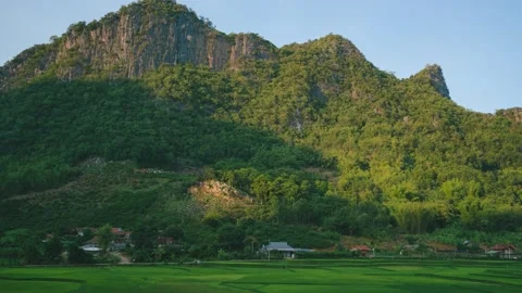 Beautiful timelapse sunlight moving on the mountain. over the rice field Stock Footage 154956832
