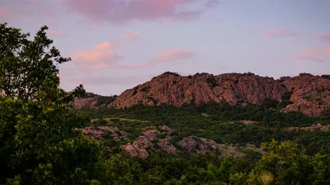 Beautiful Timelapse of Sunrise Casting Light over Rocky Mountain Top 4K Stock-Footage 163766359