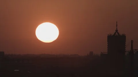 Beautiful timelapse of a sunset over city buildings 4K Stock Footage