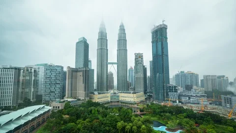 Beautiful timelapse video of raining clouds enveloping the Petronas Twin Towers Stock Footage 94823446