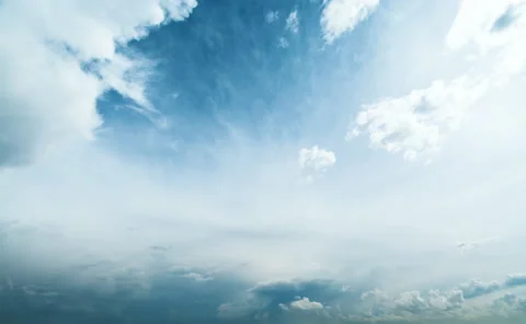 Beautiful timelapse of white fluffy clouds moving softly across blue sky. Stock Footage 138966886