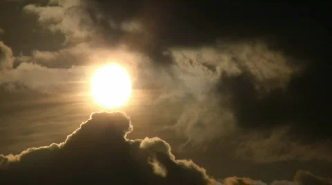Beautiful timelapsed clouds slowly drift against the sun (High Definition) Stock Footage 67833