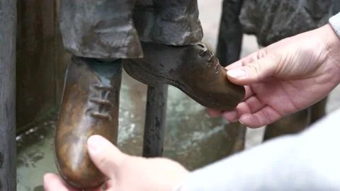 Beautiful tiny bronze shoes Stock Footage 153371336
