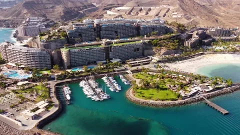 Beautiful tiny habor of Mogán with Love island Stock Footage 153539922