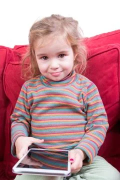 Beautiful toddler with a tablet computer Stock Photos