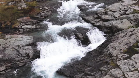 Beautiful top down aerial perspective of a powerful mountain river flowing .. Stock Footage 323971770