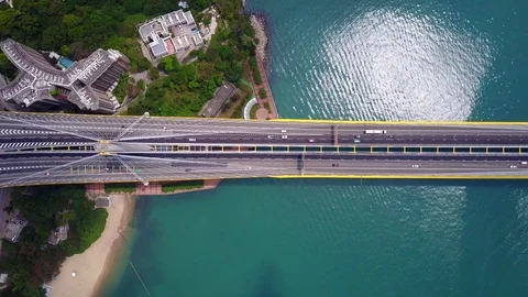 Beautiful top-down shot of traffic on modern cable stayed bridge, aerial view Stock Footage 75990851