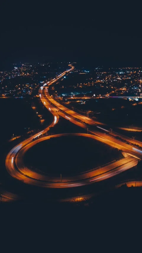 Beautiful top view time-lapse of car traffic at roundabout lane and buildings Stock Footage 231432724