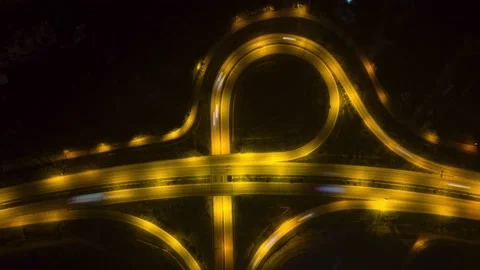Beautiful top view time-lapse of car traffic at roundabout lane and buildings Stock Footage 231432775