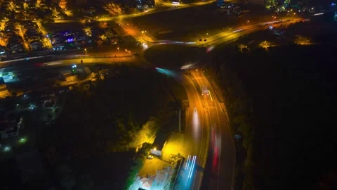 Beautiful top view time-lapse of car traffic at roundabout lane and buildings Stock Footage 233012453
