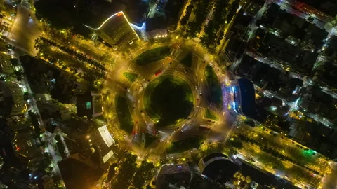 Beautiful top view time-lapse of car traffic at roundabout. 4K drone aerial. Stock Footage 239505038
