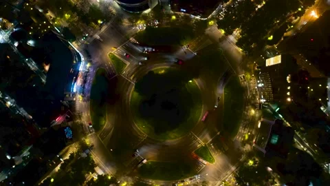 Beautiful top view time-lapse of car traffic at roundabout. 4K drone aerial. Stock Footage 239705842