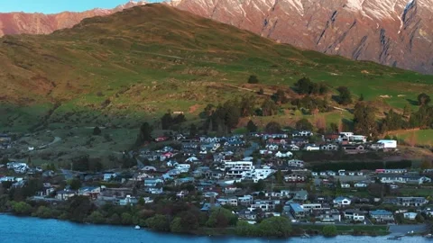 Beautiful town surrounded by snow-capped mountains and lakes Stock Footage 257654030