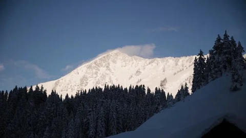 Beautiful tracking shot of mount peak in Swiss Alps in winter Stock Footage 226201649