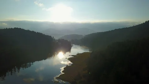 Beautiful Tranquil River Reflection Pine Forest Mountains Sunrise Drone View Video stock 119889599