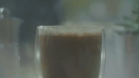 Beautiful transparent cup of coffee on the table Stock Footage 100900501