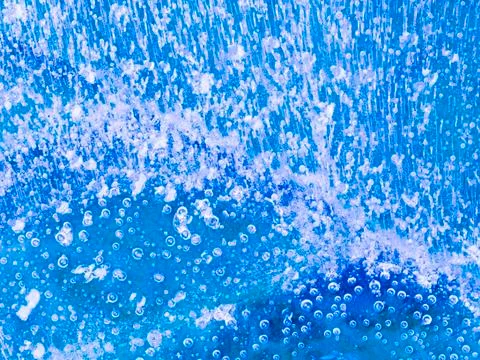 Beautiful transparent thin blue ice Stock Photos