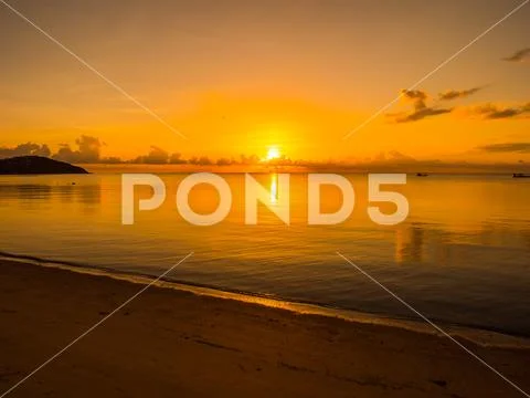 Beautiful tropical beach and sea ocean landscape with cloud and sky at sunris Stock Photos
