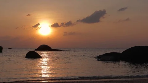 Beautiful tropical sunset. Small ripples on the water at the sunset time. Stock Footage 99891779