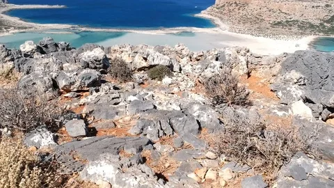 A beautiful turquoise colored beach behind the rocks Stock Footage 114288442