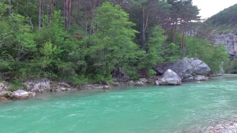 A beautiful turquoise river flows in the mountainous regions of Provence. France Stock Footage 94375130