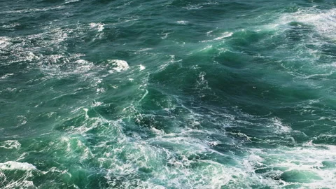 Beautiful turquoise waves of the deep Atlantic Ocean near Nazare Portugal View Stock Footage 229587113