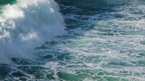 Beautiful turquoise waves of the deep Atlantic Ocean near Nazare, Portugal View Stock-Footage 231647574