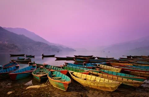 Beautiful twilight landscape with boats on phewa lake, pokhara, nepal Stock Photos