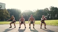 Beautiful Two Girls And Two Boys Doing Jump Squats Stock Footage