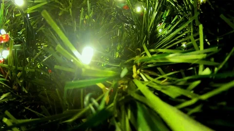 A beautiful unique view of a fully decked out Christmas Tree in slow motion Stock Footage 100054049