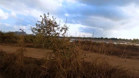 Beautiful unpaved road with dramatic clouds Stock Footage 124191229