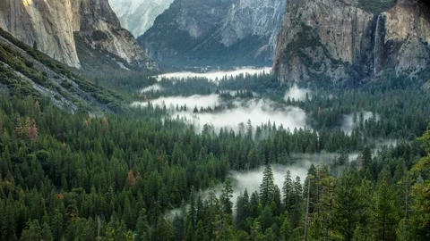 Beautiful Valley between Big Mountains Clouds Timelapse Stock Footage 138868904