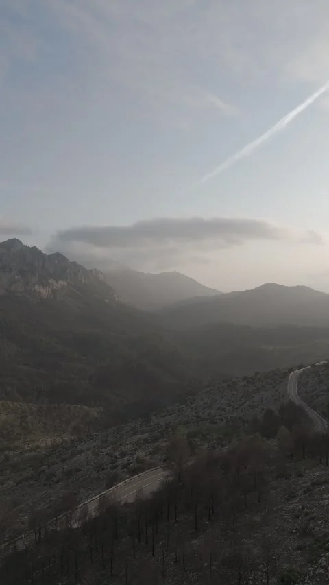 Beautiful vertical drone view of spain landscape with clouds and mountains Video stock 300553635