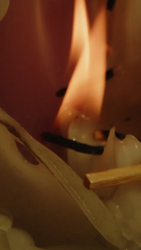Beautiful vertical macro of orange flames burning in slow motion on a pile of Video stock 336372321