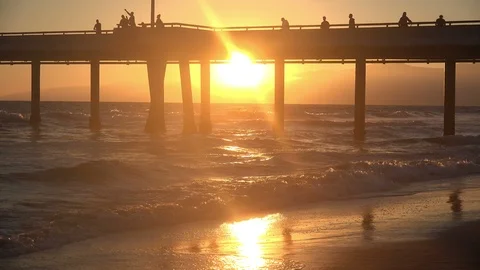 Beautiful, vibrant amber sunset under the Venice beach pier Stock Footage 113243702