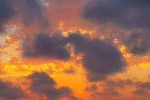 Beautiful vibrant sunset with dramatic clouds Stock Photos